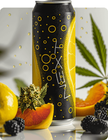 Black can with yellow design on a table with fruits and cannabis leaves