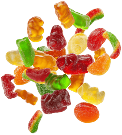 Assorted gummies floating on a transparent background.